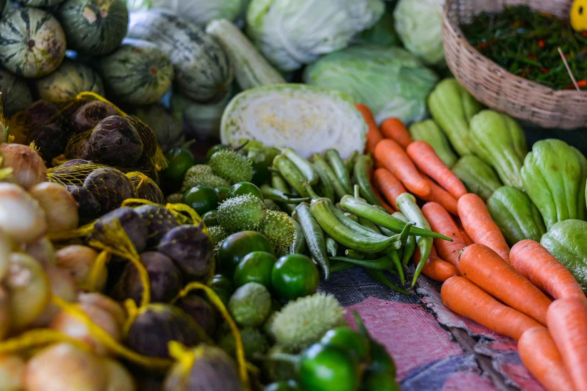 Fresh herbs and vegetables at a Thai market