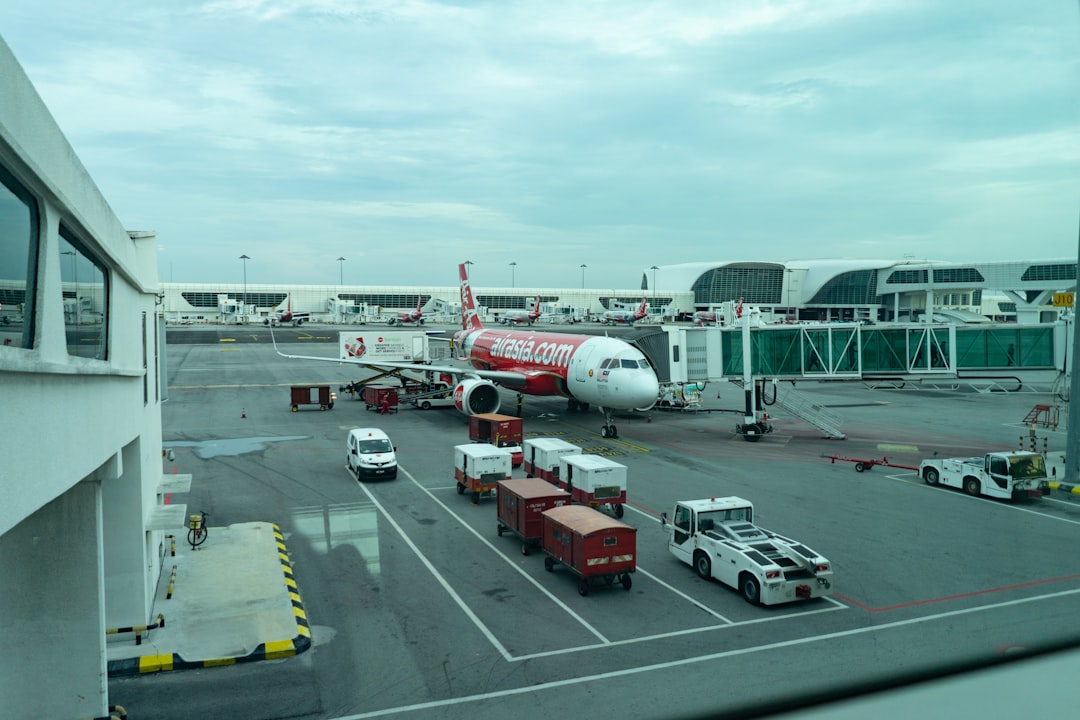 KLIA airport terminal exterior showing modern architecture and surrounding landscape