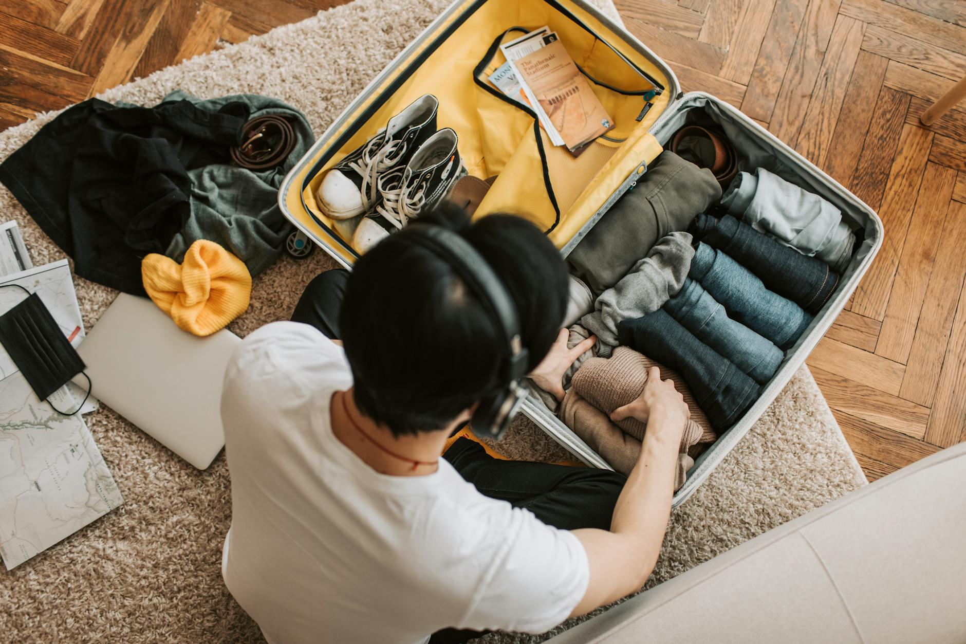 Neatly organized suitcase with color-coded packing cubes for efficient travel