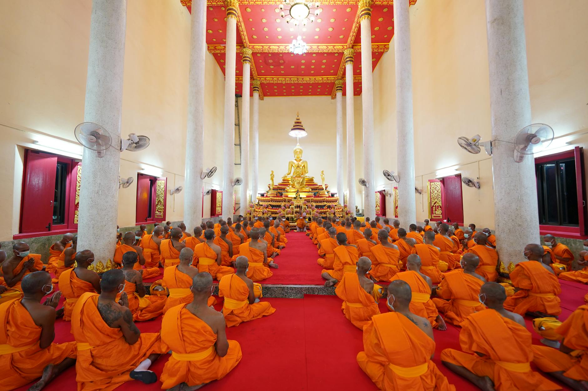 The Phraya Raek Na selecting the ceremonial cloth as Brahmin priests look on during the Royal Ploughing Ceremony
