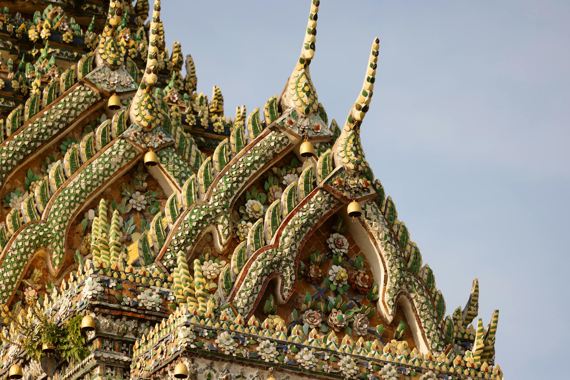 Tourists respectfully participating in a candlelight procession at a Thai Buddhist temple