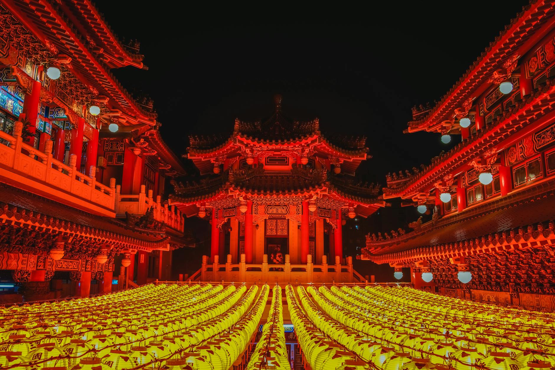 Close-up of a traditional khom loy lantern being lit before release at a Buddhist temple